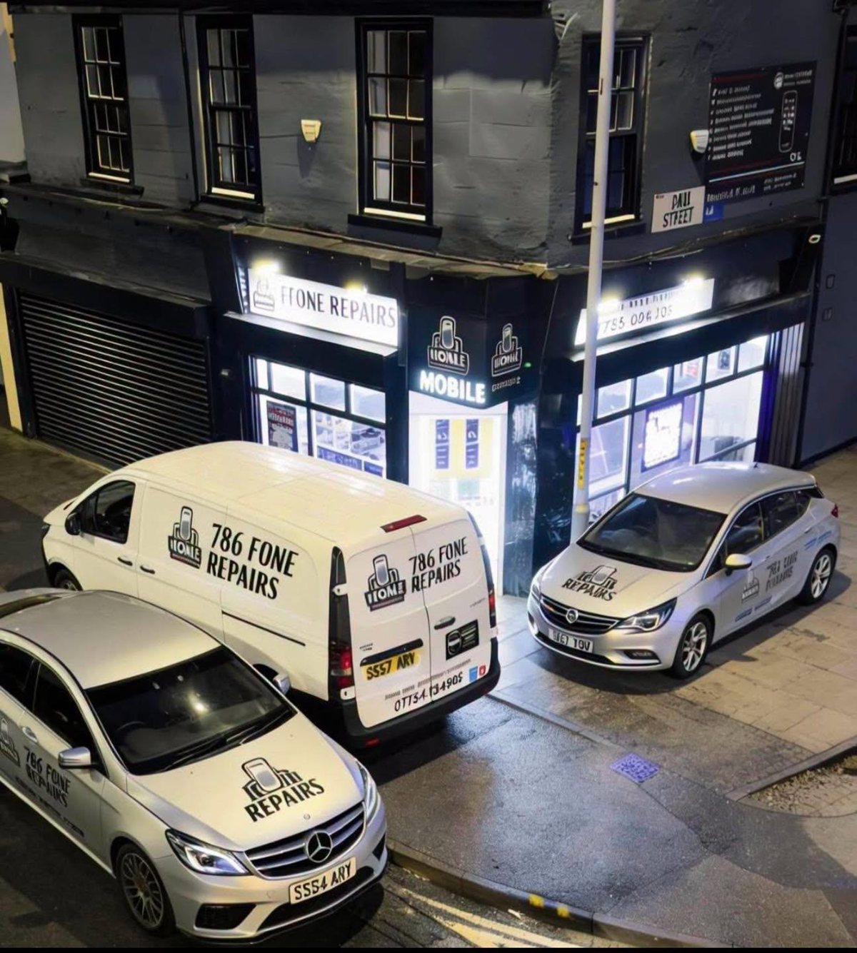 786 Fone Repair storefront and branded vehicles